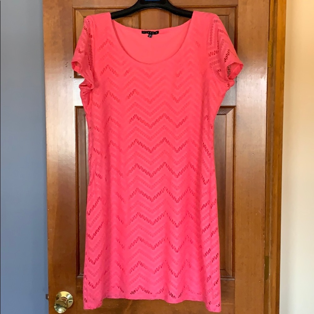 Salmon color dress.